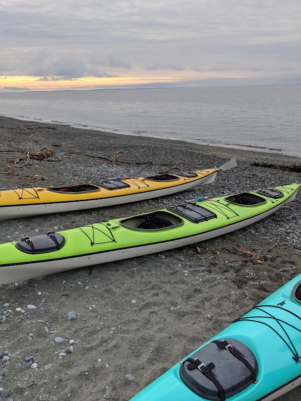 Sea kayakers exploring the shoreline of the San Juan Islands near Friday Harbor, Washington