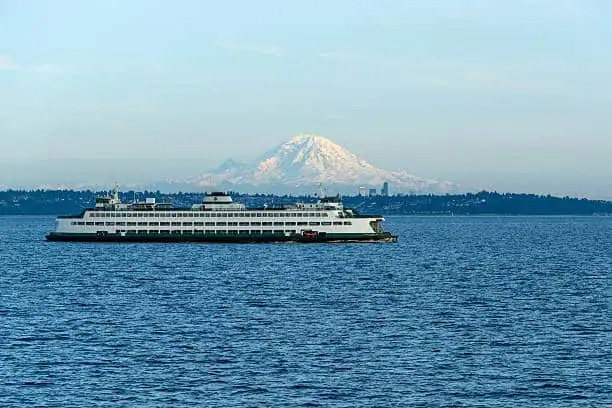 Seattle Washington USA   May   A ferry Walla Walla is on its route crossing Puget Sound between Edmonds and Kingston with Mount Rainier and Seattle Downtown in the background