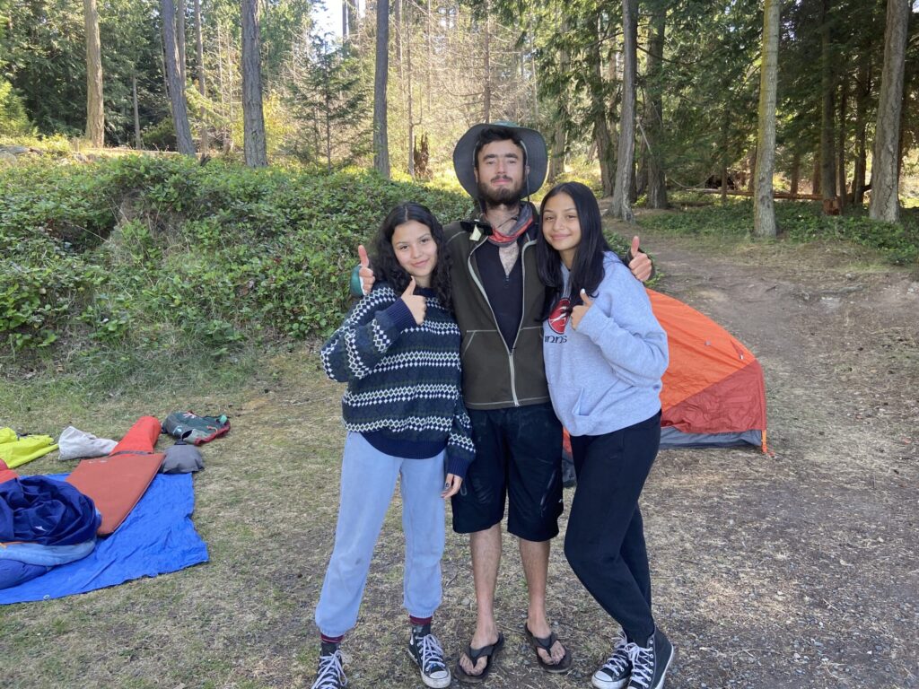 are-killer-whales-dangerous | Sea Quest Kayak Tours Three people at a campsite, giving thumbs up.