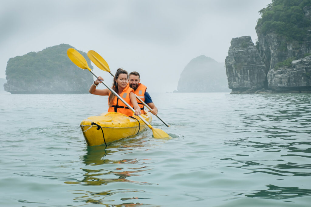 Couple,Rowing,Kayak,At?,Sea,Covered,With,Fog,And,Mist | Sea Quest Kayak Tours Couple rowing using kayak at covered fog with mist