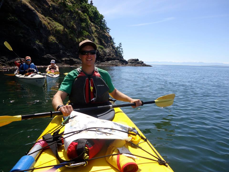 a happy kayak guide on a rental trip near san juan island