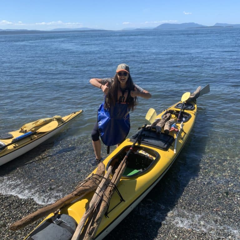 gathering driftwood on a sea kayak camping trip